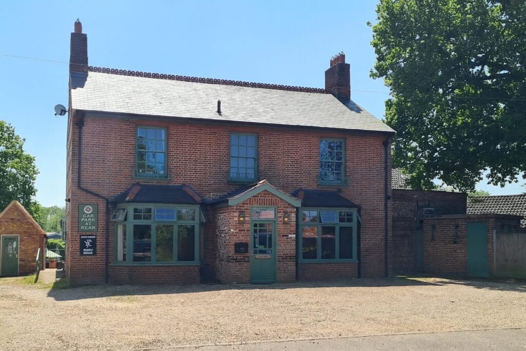 The front shot of the railway arms pub in north elmham in Norfolk with an empty car park