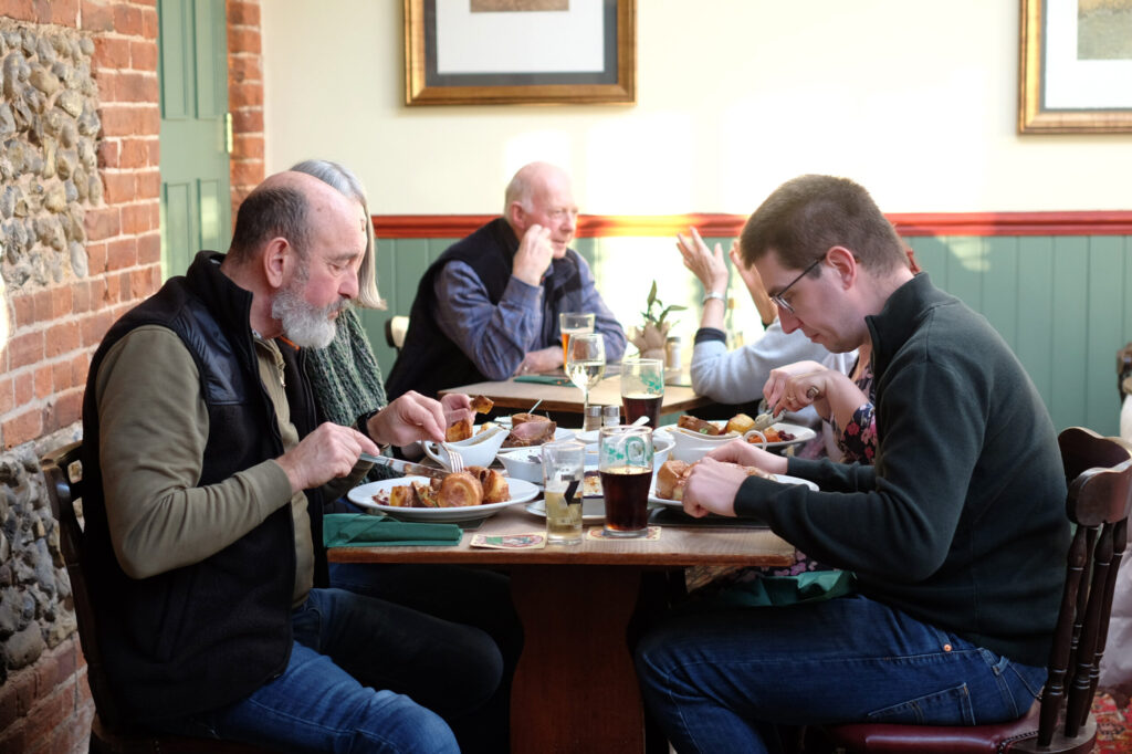 People enjoying a Sunday roast in a local country pub